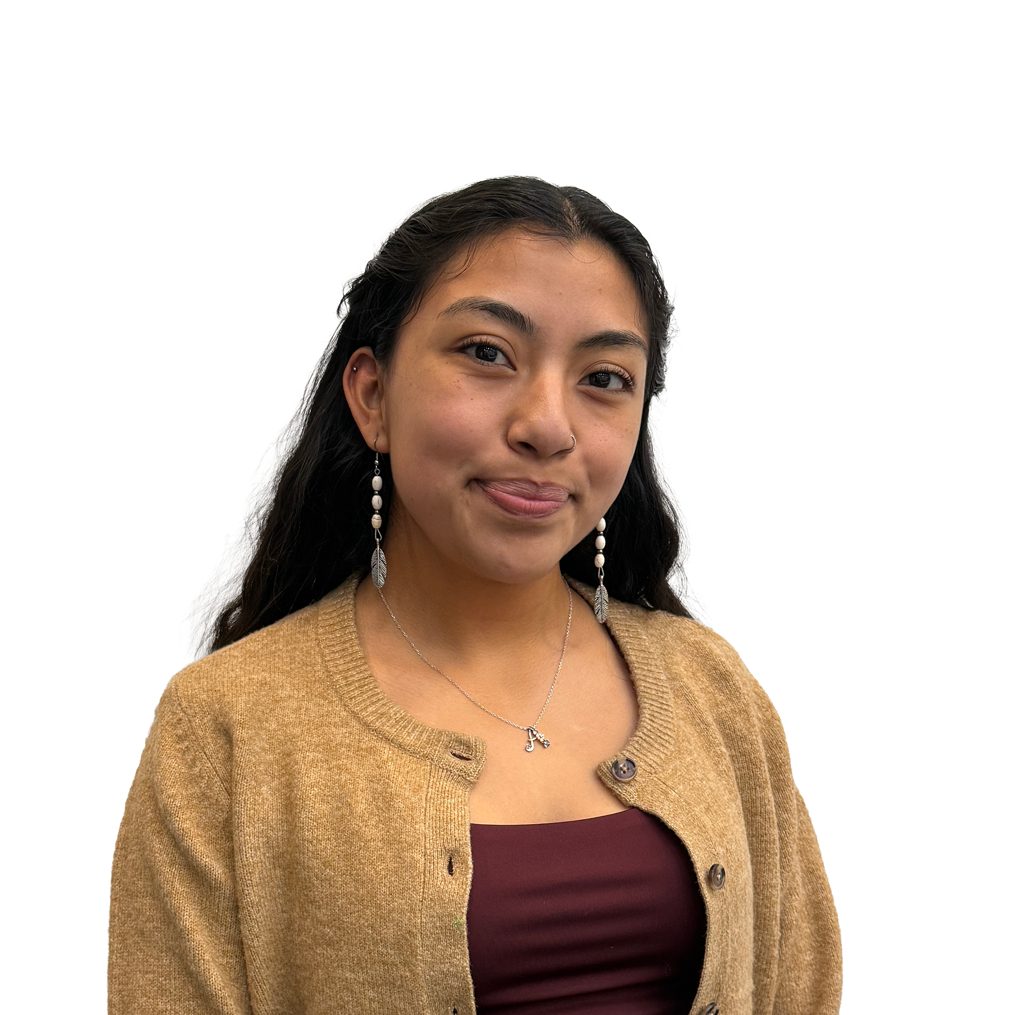 A young woman with long dark hair, wearing a tan cardigan and burgundy top, smiles softly at the camera.